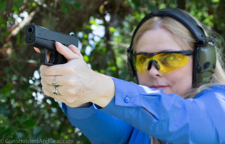 In this photo, a beautiful blonde woman is shooting the 9mm Glock 43 pistol. Here she is shooting targets are objects in various forms and shapes that are used for pistol, rifle, shotgun and other shooting sports. 