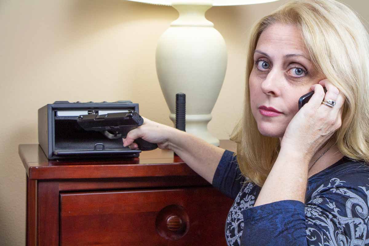 beautiful blonde woman with 9mm pistol for self defense