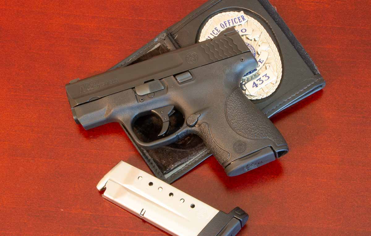 concealed carry pistol from Smith and Wesson with police badge