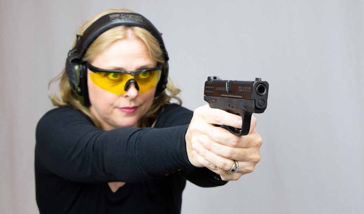 sexy woman concealed carry self defense with 9mm pistol