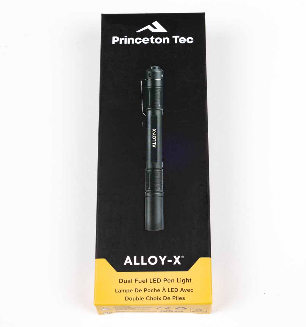 The Princeton Tec Alloy-X flashlight is displayed in its retail packaging, showing the light, rechargeable 10900 Li-ion battery, and USB-C charging cable. The packaging features the brand name, model designation, and key specifications including 400-lumen maximum output and IPX7 waterproof rating. The flashlight is positioned so that the integrated steel pocket clip and black anodized aluminum body are visible. Text on the package highlights its dual-fuel capability, allowing the use of AAA batteries as a backup. The box is compact, reflecting the light’s portability and penlight design. This complete kit is priced at $61.99, offering good value for the included accessories. The image communicates both the product’s capabilities and its ready-to-use nature.