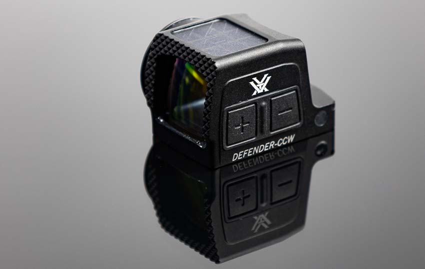 Vortex Defender-CCW Enclosed red dot sight shown out of original packaging before installation on Springfield Armory Hellcat Pro concealed carry pistol. The compact enclosed optic design features a low-profile housing ideal for CCW applications with motion-activated dot technology. Vortex red dot sights for concealed carry handguns offer duty-grade reliability at affordable prices for everyday carriers. The Defender-CCW enclosed reflex sight includes mounting hardware and battery for immediate installation on micro-compact pistols. This pistol red dot optic provides shockproof construction and waterproof sealed housing to protect against lint, moisture, and debris during daily concealed carry. The Vortex CCW red dot brings professional-grade optic performance to civilian concealed carry firearms without premium pricing. Enclosed red dot sights like the Defender-CCW offer superior protection compared to open emitter designs for EDC handguns.