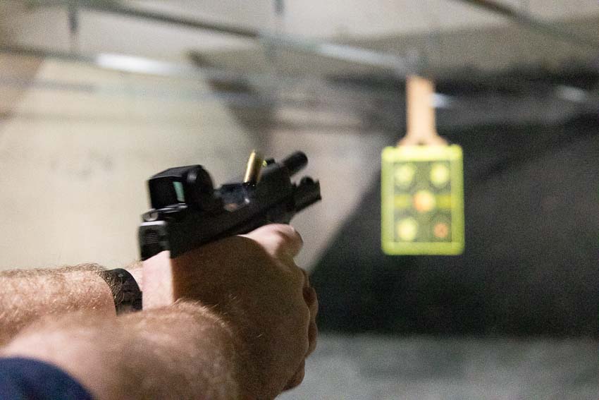 Detailed evaluation of Vortex Defender-CCW Enclosed red dot sight during shooting range performance assessment and hands-on testing protocols. The enclosed pistol optic features anti-reflective lens coatings that maintain clarity during bright sunlight and varying lighting conditions at the range. Vortex Defender CCW enclosed sight evaluation reveals duty-grade construction quality comparable to premium defensive handgun optics. Testing concealed carry red dot sights requires assessing lens clarity, dot brightness consistency, and housing integrity under actual shooting conditions. The compact reflex sight design shows no signs of internal fogging or moisture intrusion despite humid range environments and temperature changes. Pistol-mounted enclosed optics like the Defender-CCW protect the red dot emitter from carbon buildup and debris that affect open emitter designs. Range evaluation of affordable CCW red dots demonstrates the Vortex optic maintains zero and provides reliable dot activation. Hands-on assessment of micro pistol red dot sights validates the Defender-CCW offers professional-level performance for everyday carriers.