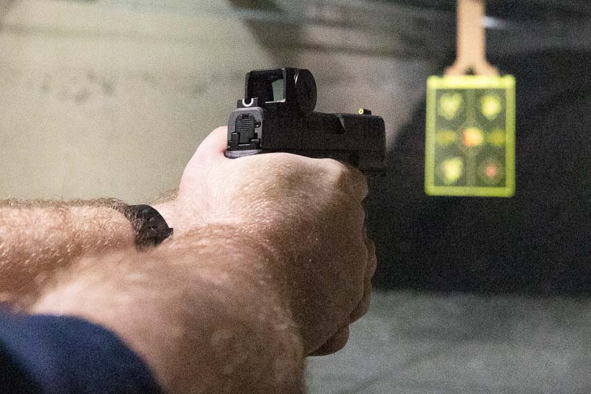 Live fire range testing of Vortex Defender-CCW Enclosed red dot sight mounted on Springfield Armory Hellcat micro-compact pistol for concealed carry evaluation. The enclosed pistol optic maintains zero retention through hundreds of rounds during rapid-fire drills and defensive shooting exercises. Vortex Defender CCW review testing demonstrates reliable performance under actual shooting conditions with consistent dot brightness and lens clarity. The compact red dot sight provides fast target acquisition on subcompact carry guns like the Hellcat during close-range defensive scenarios. Testing pistol-mounted optics for EDC reveals the Defender-CCW's shockproof construction handles recoil and rough handling without losing accuracy. The enclosed reflex sight design prevents sweat, carbon fouling, and range debris from obscuring the red dot emitter during extended shooting sessions. Vortex CCW red dot sights deliver duty-grade reliability for civilian concealed carriers during real-world performance testing. Range evaluation of affordable pistol optics shows the Defender-CCW competes with premium red dot sights costing twice the price.