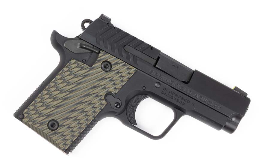 A profile view from the right side displays the Springfield 911 9mm pistol, showcasing the steel slide, aluminum frame, ambidextrous thumb safety lever, slide stop, and compact 3-inch barrel length. The Springfield 911 9mm review examines all control locations and frame dimensions. Right-side controls mirror left-side placement for ambidextrous operation. The Springfield Armory 911 features a full-length guide rod beneath the barrel. Slide serrations enable reliable manipulation during press checks and malfunction clearances. Compact pistol profiles facilitate inside-the-waistband carry positions.