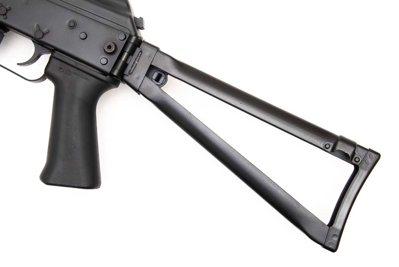 A close-up photograph captures the KR-9's skeleton-style buttstock showing its minimalist framework construction. The KR-9 rifle incorporates fixed-length collapsible stock geometry. Nine-millimeter carbines provide compact storage through folding capabilities. The KUSA 9mm pistol caliber carbine measures nine inches in stock length. Semi-automatic firearms balance portability with shooter comfort. Defensive carbines offer versatile stock configurations for users.