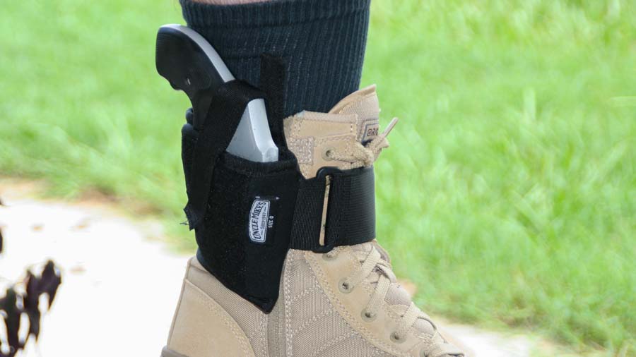 Smith and Wesson 642 carried in ankle holster attached to uniform boot