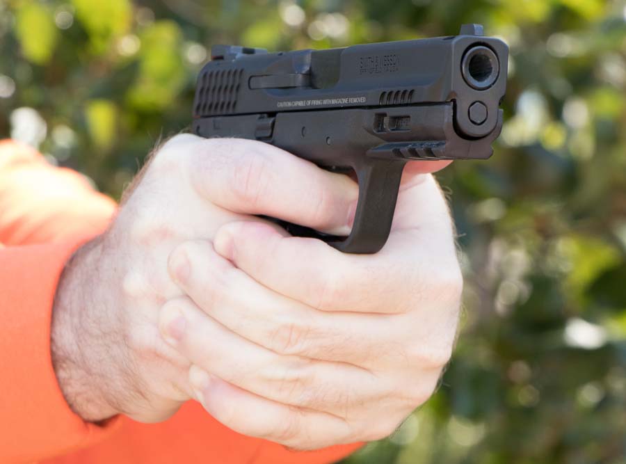 gripping the Smith & Wesson M&P 9 2.0 during range testing