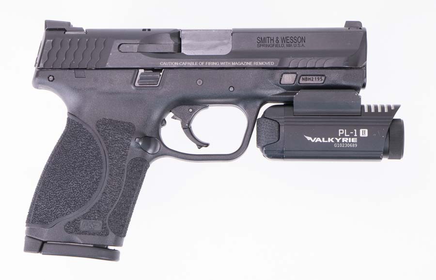 right side of Smith and Wesson M and P 9mm 20 compact with Olight Valkyrie mounted on the accessory rail