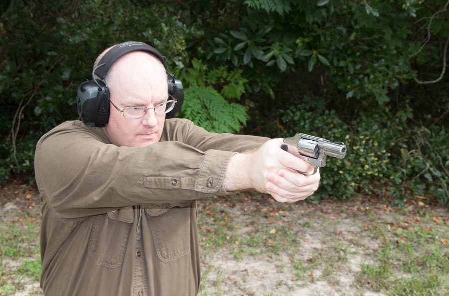author evaluating the S&W 640 on the shooting range