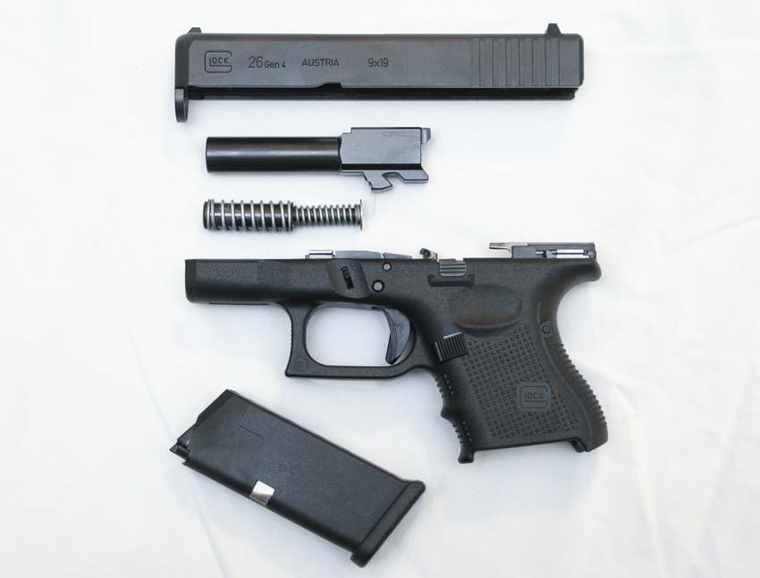Glock 26 field strip into magazine frame barrel slide and dual recoil spring guide rod